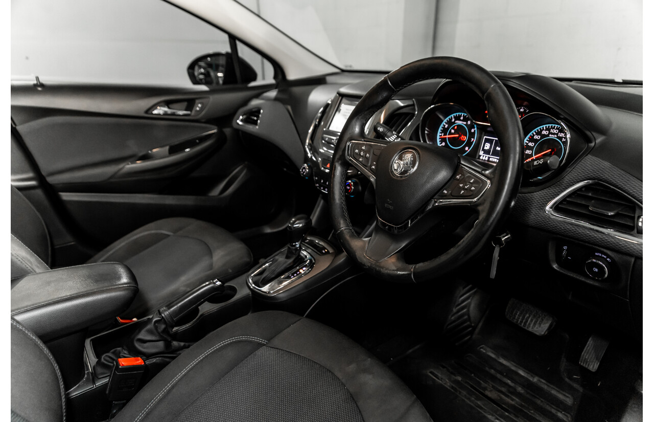 06/2017 Holden Astra LS Plus (FWD) BL MY17 4d Sedan Mineral Black Turbo 1.4L