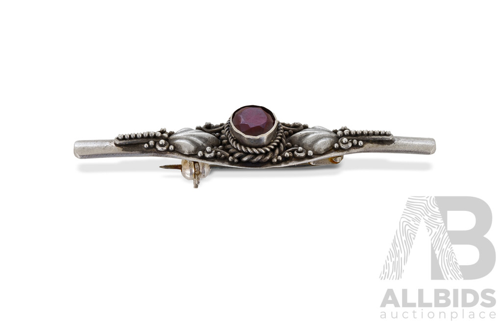 Sterling Silver Garnet Set Bracelet and Brooch Eight Link Bracelet with Floral Design, Each Link Set with Oval Garnet. Together with a Matching Bar Brooch.