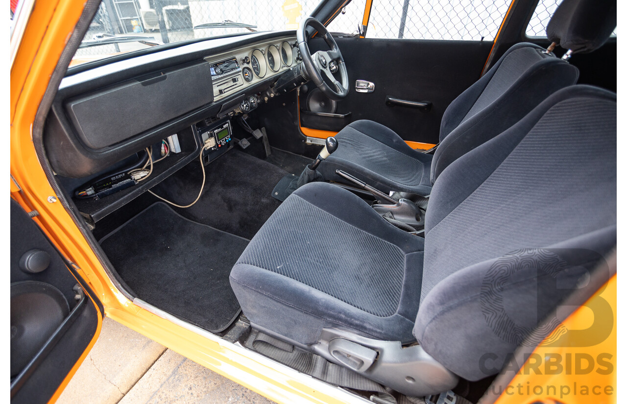 6/1971 Datsun 1200 Deluxe 2d Coupe Orange Turbo 1.8L - Modified & Engineered