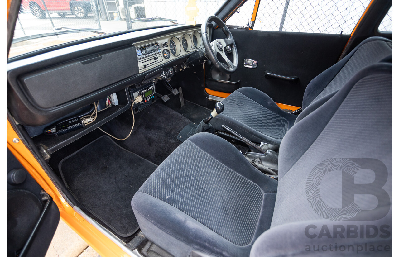 6/1971 Datsun 1200 Deluxe 2d Coupe Orange Turbo 1.8L - Modified & Engineered
