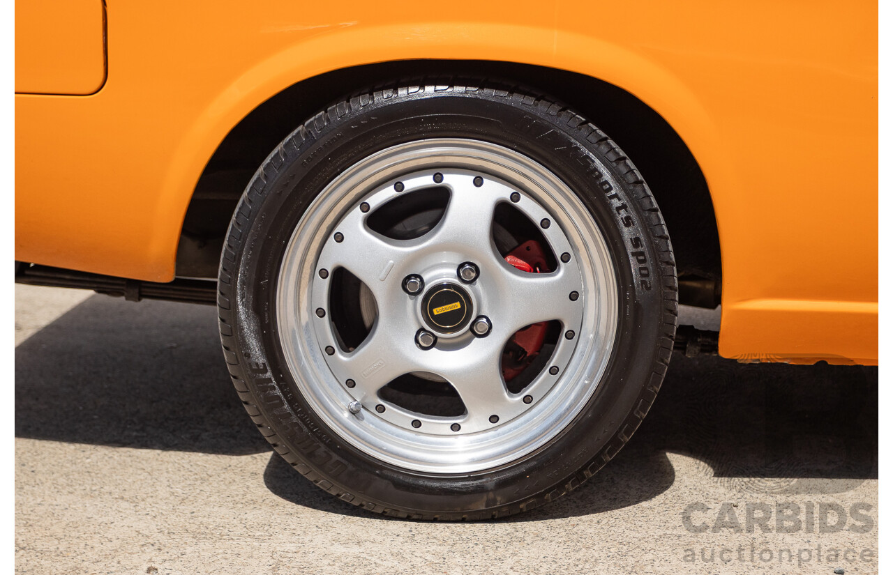 6/1971 Datsun 1200 Deluxe 2d Coupe Orange Turbo 1.8L - Modified & Engineered