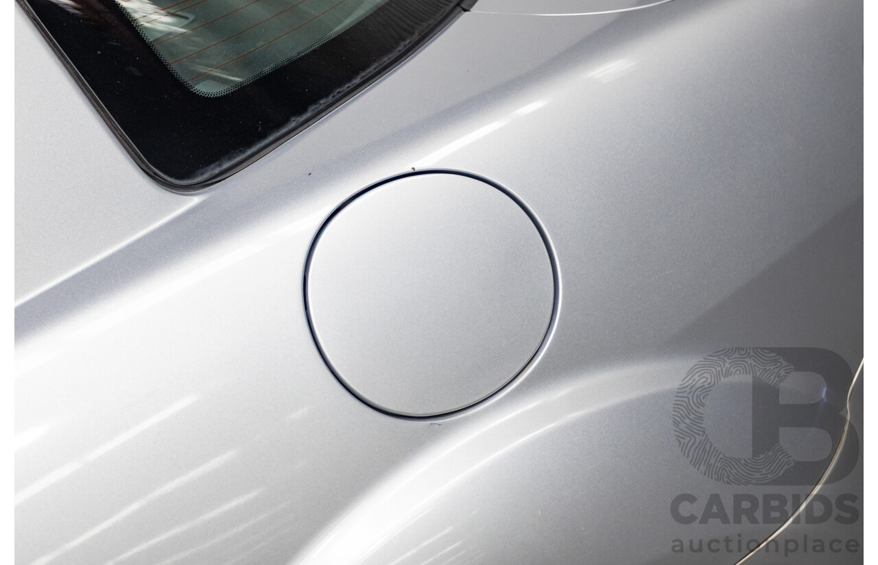 9/2005 Mazda RX-8 FE Series 1 4d Coupe Sunlight Silver Metallic 1.3L