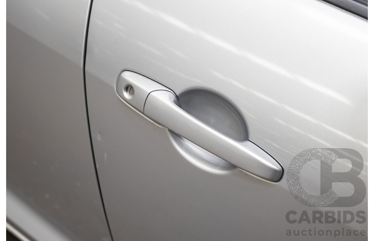 9/2005 Mazda RX-8 FE Series 1 4d Coupe Sunlight Silver Metallic 1.3L