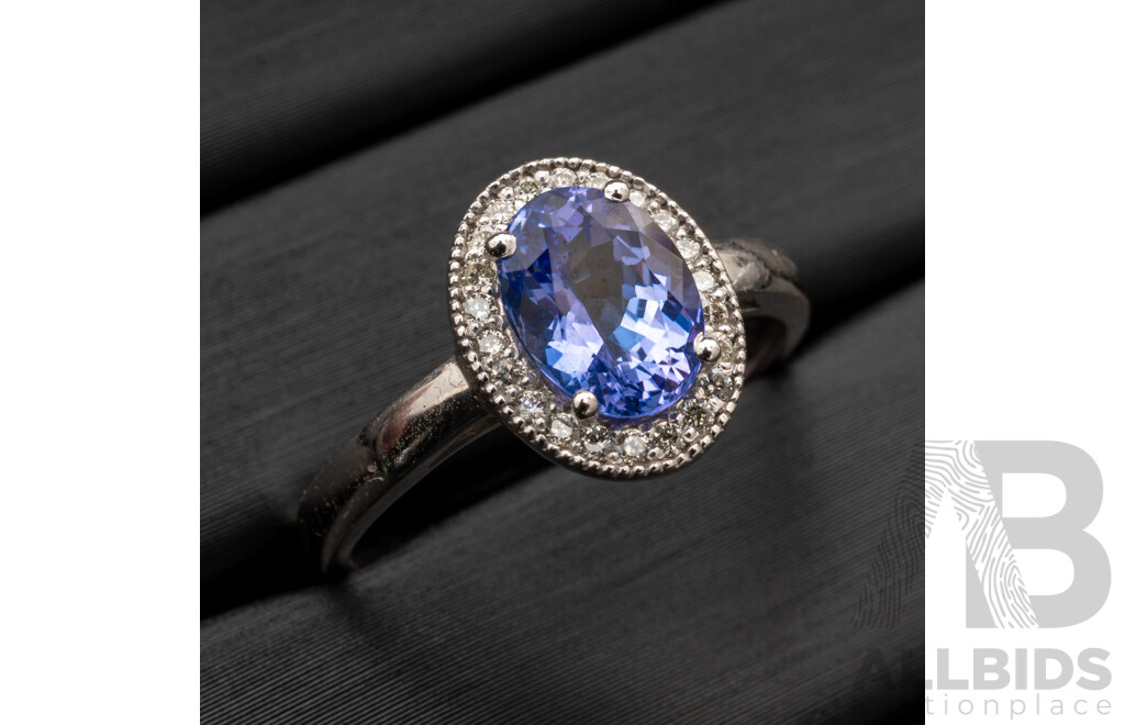 BRAND NEW - 9ct White Gold Tanzanite & Diamond Halo Ring, S1.40ct/TDW0.165ct, Size M, 2.72 Grams