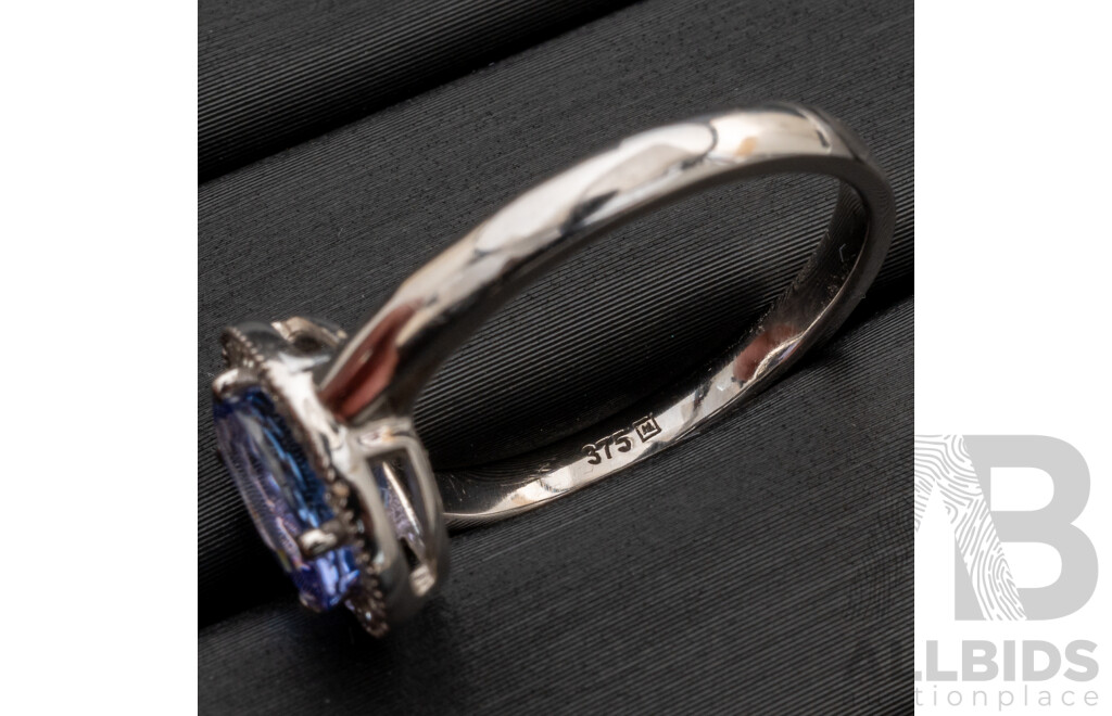 BRAND NEW - 9ct White Gold Tanzanite & Diamond Halo Ring, S1.40ct/TDW0.165ct, Size M, 2.72 Grams