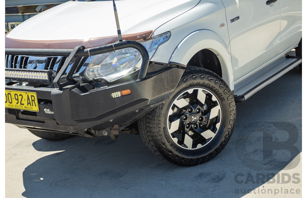 02/2016 Mitsubishi Triton GLX (4x4) MQ MY16 UPGRADE Dual Cab Utility White Turbo Diesel 2.4L