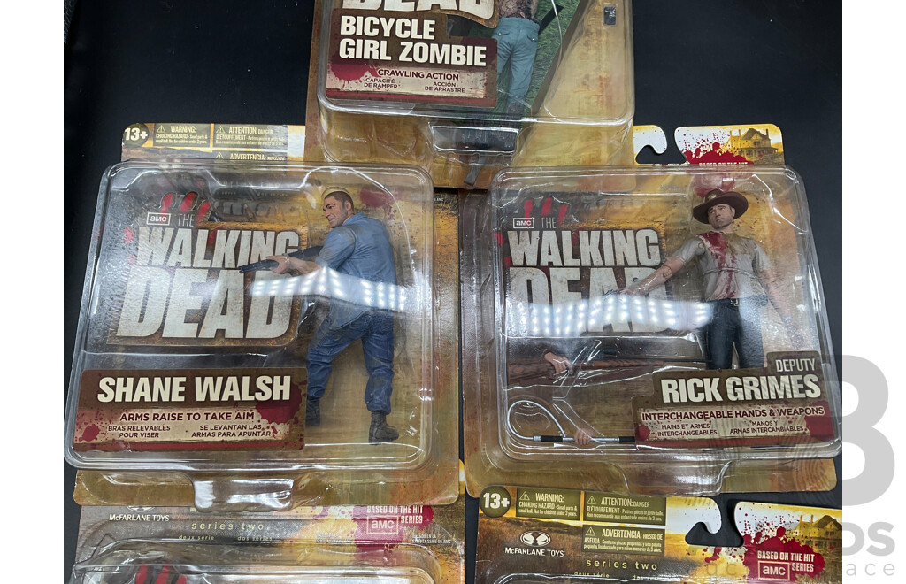 Assorted the Walking Dead Collectable Action Figures and Books - Lot of 8
