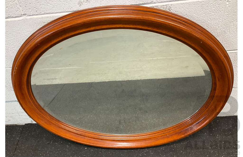 Oval Wall Mirror with a Wooden Frame