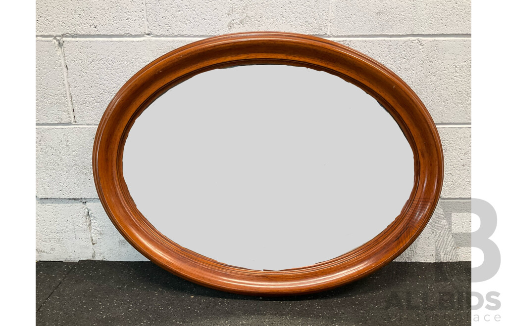 Oval Wall Mirror with a Wooden Frame