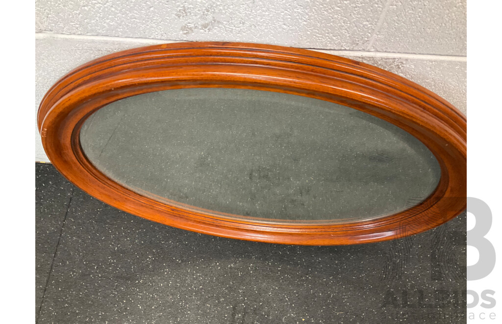 Oval Wall Mirror with a Wooden Frame