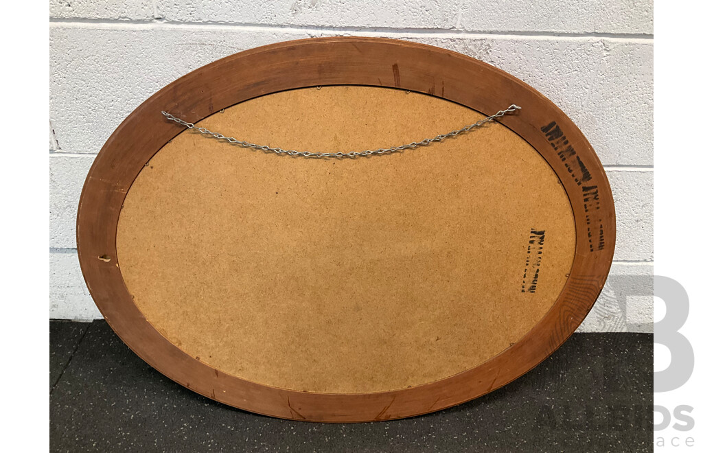 Oval Wall Mirror with a Wooden Frame