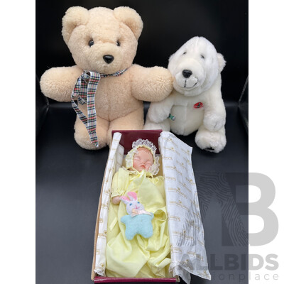 ASHTON DRAKE Porcelain Baby Doll ''Little Bit of Sunshine'', Tambo Teddies Bear and CocaCola Plush Polar Bear and Meerkat Plush Toy - Lot of 4 ASHTON DRAKE Porcelain Baby Doll ''Little Bit of Sunshine'', Tambo Teddies Bear and CocaCola Plush Polar Bear and Meerkat Plush Toy - Lot of 4