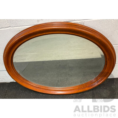 Oval Wall Mirror with a Wooden Frame