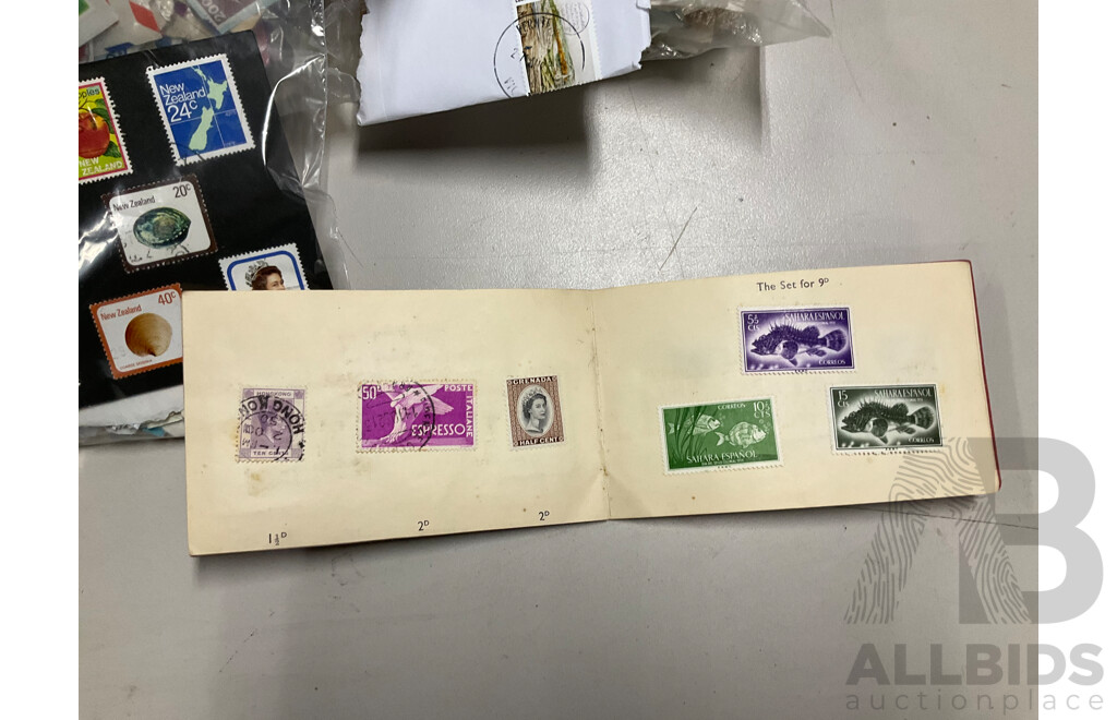Collection of International Cancelled Stamps Including USA, New Zealand, Australia, UK, Germany, Malaysia, India, Romania, Italy and More - Approximately Two Kilograms