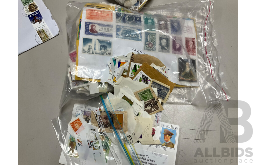 Collection of International Cancelled Stamps Including USA, New Zealand, Australia, UK, Germany, Malaysia, India, Romania, Italy and More - Approximately Two Kilograms