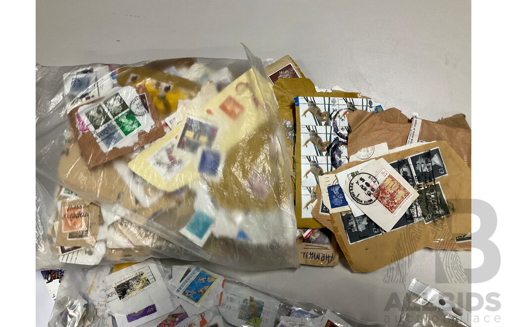 Collection of International Cancelled Stamps Including USA, New Zealand, Australia, UK, Germany, Malaysia, India, Romania, Italy and More - Approximately Two Kilograms