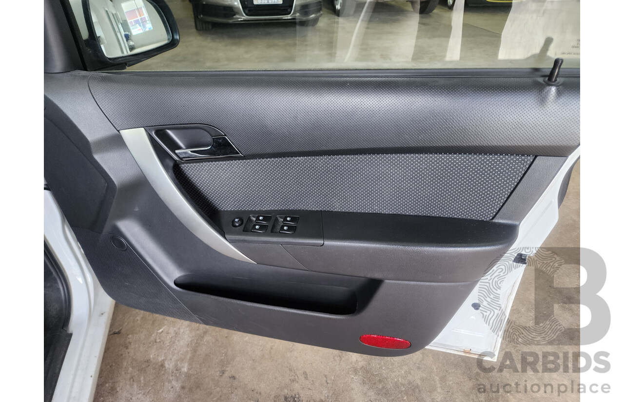 9/2011 Holden Barina  TK MY11 5d Hatchback White 1.6L