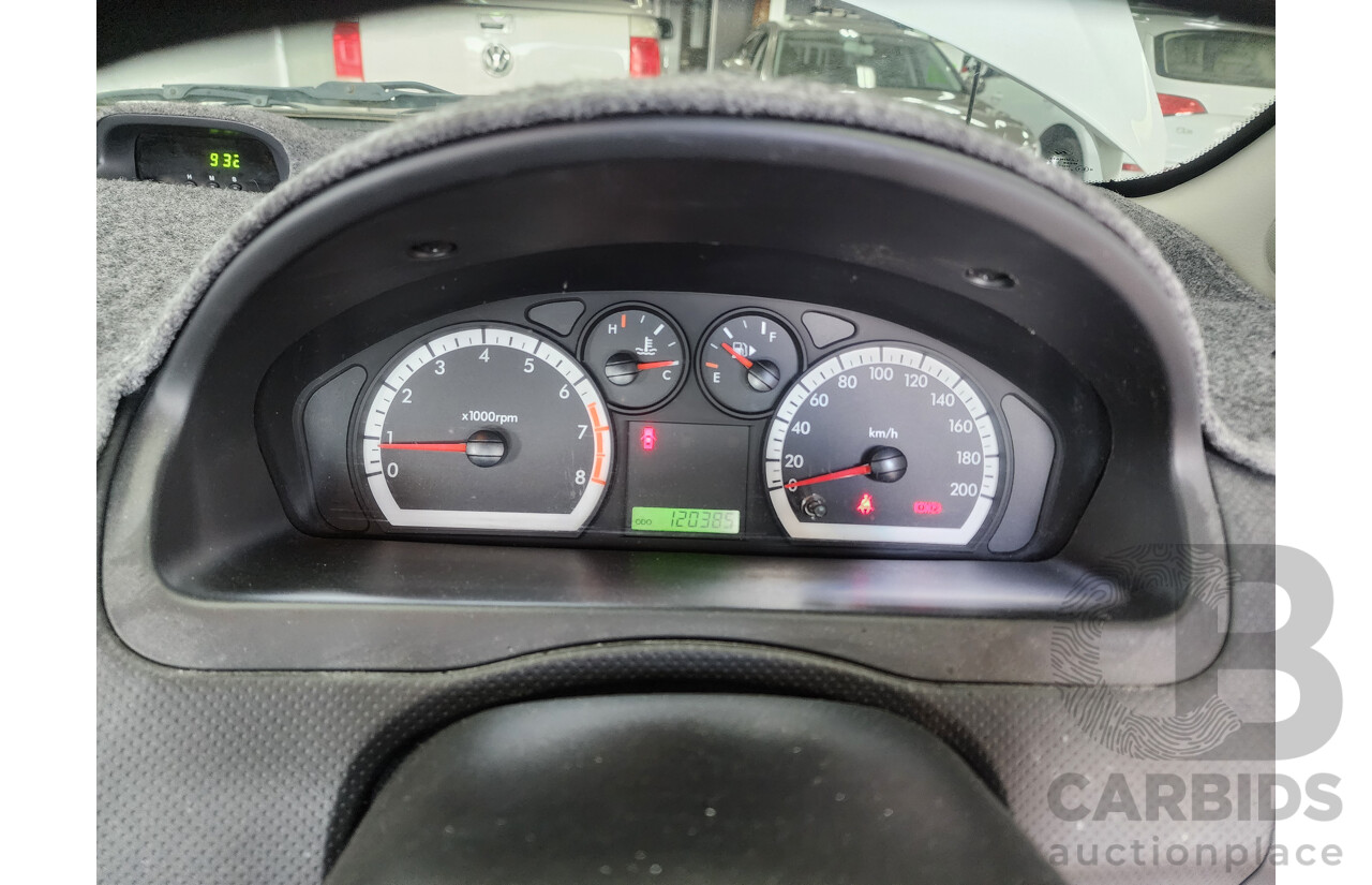 9/2011 Holden Barina  TK MY11 5d Hatchback White 1.6L