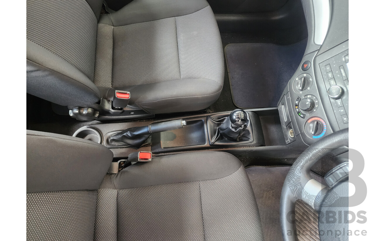 9/2011 Holden Barina  TK MY11 5d Hatchback White 1.6L