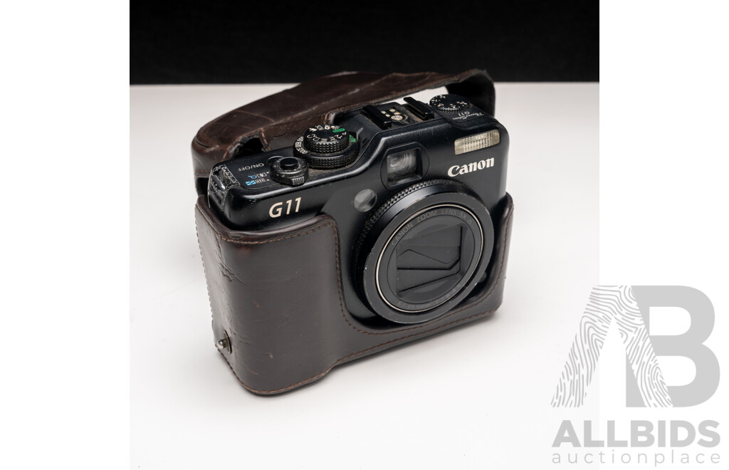 FujiFilm X-E1 Digital Camera with Fujinon Aspherical Super EBC XF 18–55mm F/2.8–4 Lens and Charger, with Canon PowerShot G11 Digital Camera with Leather Case and Charger