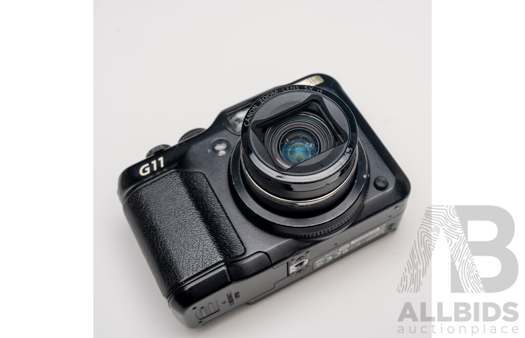 FujiFilm X-E1 Digital Camera with Fujinon Aspherical Super EBC XF 18–55mm F/2.8–4 Lens and Charger, with Canon PowerShot G11 Digital Camera with Leather Case and Charger