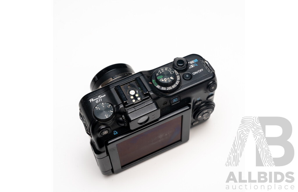 FujiFilm X-E1 Digital Camera with Fujinon Aspherical Super EBC XF 18–55mm F/2.8–4 Lens and Charger, with Canon PowerShot G11 Digital Camera with Leather Case and Charger