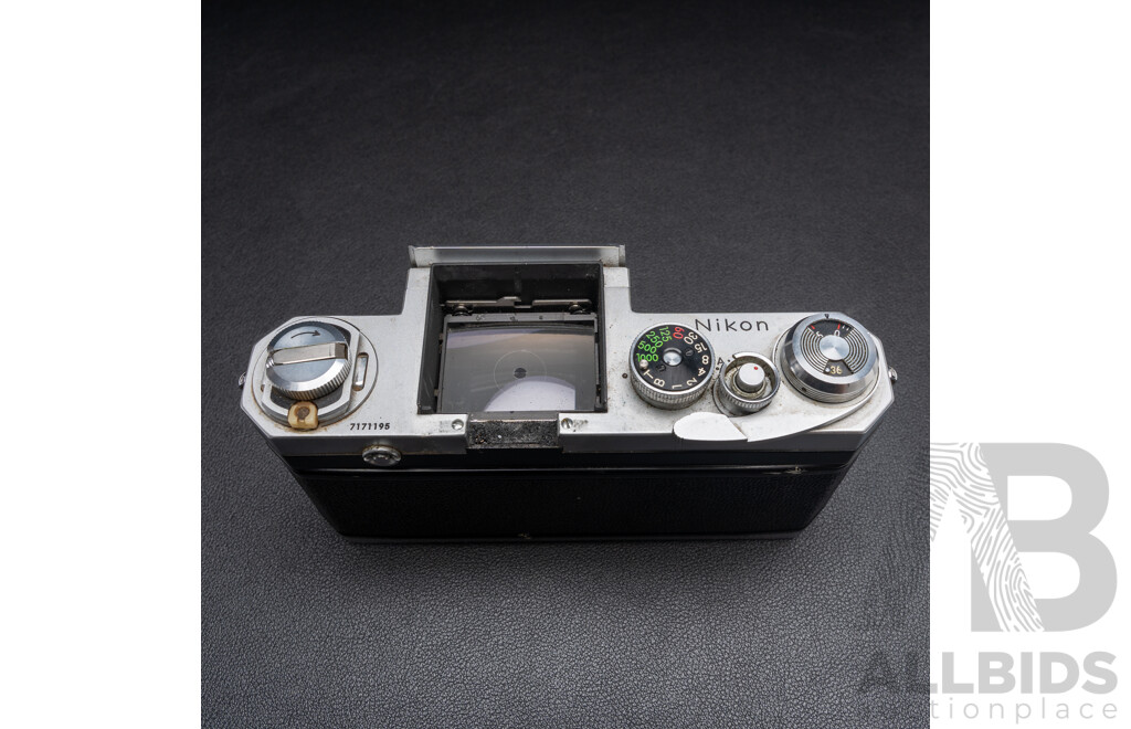 Nikon F Camera with 50mm F/1.4 Lens, Nikon 20mm F/3.5 Lens, Nikon 70–210mm F/4–5.6 Lens, Nikon 500mm F/8 Mirror Lens and Nikon CoolScan IV Digital Scanner