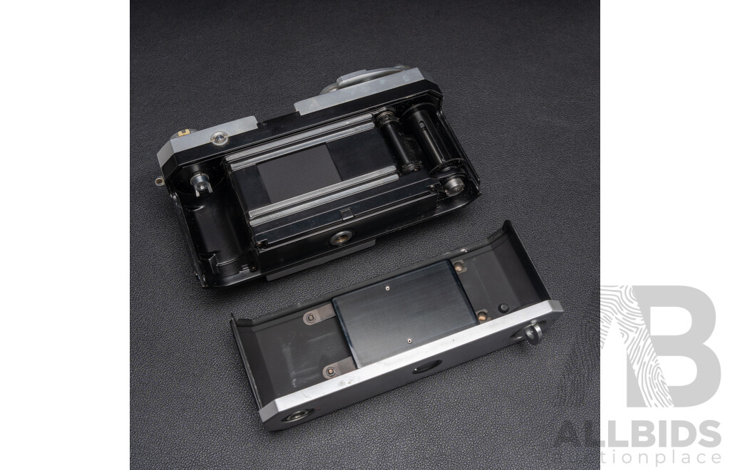 Nikon F Camera with 50mm F/1.4 Lens, Nikon 20mm F/3.5 Lens, Nikon 70–210mm F/4–5.6 Lens, Nikon 500mm F/8 Mirror Lens and Nikon CoolScan IV Digital Scanner