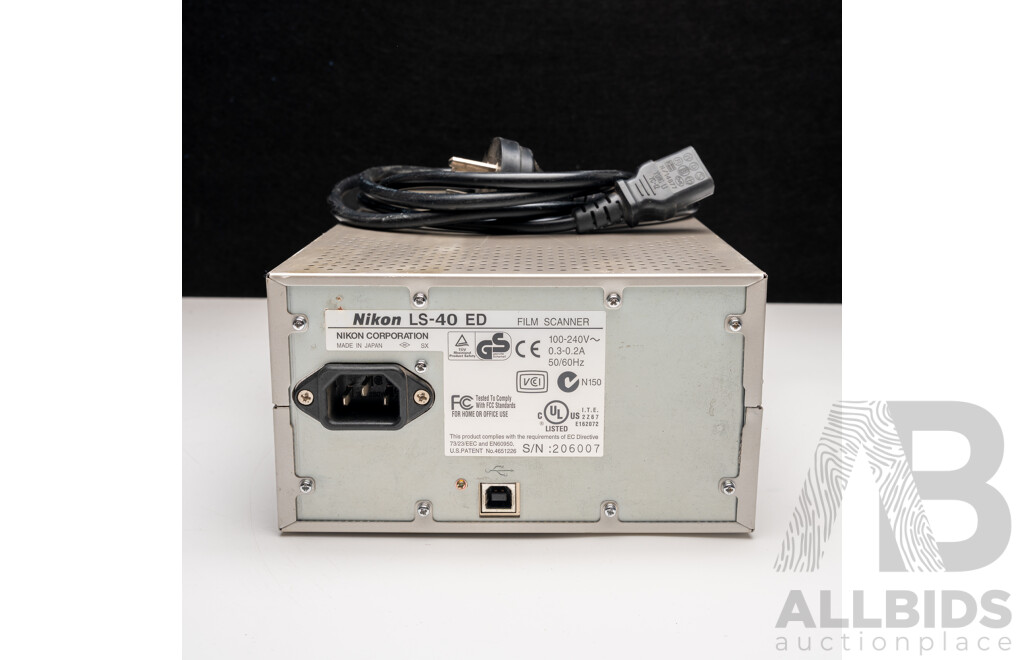 Nikon F Camera with 50mm F/1.4 Lens, Nikon 20mm F/3.5 Lens, Nikon 70–210mm F/4–5.6 Lens, Nikon 500mm F/8 Mirror Lens and Nikon CoolScan IV Digital Scanner