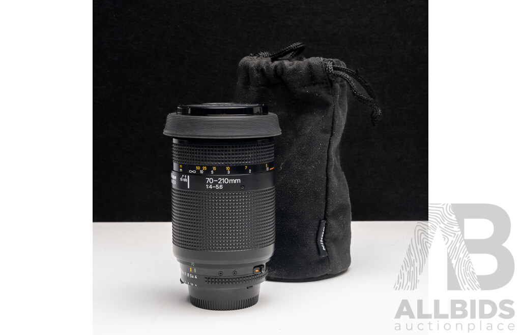 Nikon F Camera with 50mm F/1.4 Lens, Nikon 20mm F/3.5 Lens, Nikon 70–210mm F/4–5.6 Lens, Nikon 500mm F/8 Mirror Lens and Nikon CoolScan IV Digital Scanner