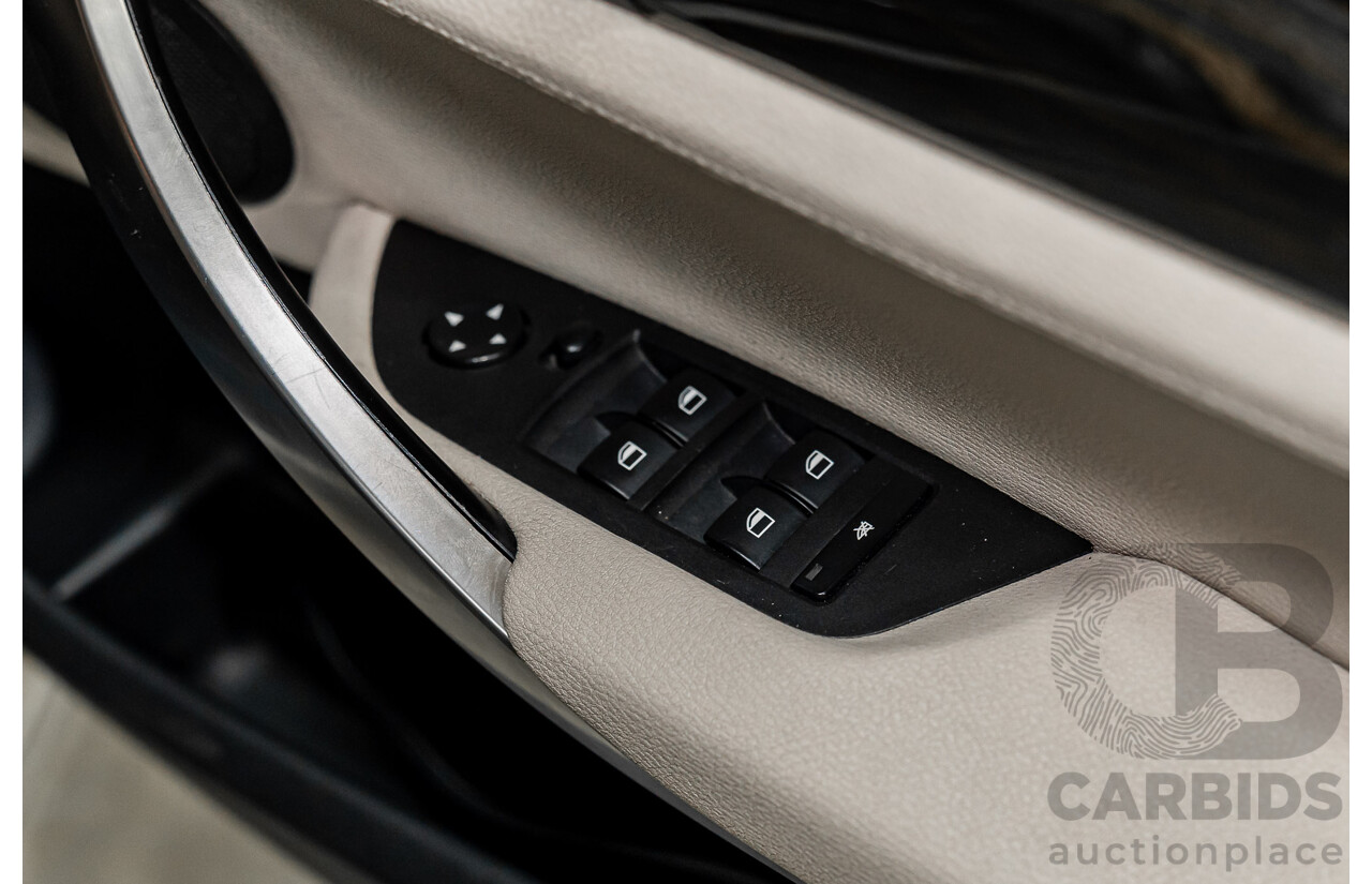 2/2011 BMW X1 xDrive23d E84 MY11 4d Wagon Deep Blue Sea Metallic Turbo Diesel 2.0L