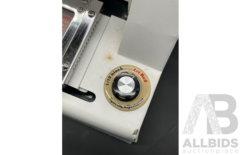 Manual Metal Embossing Machine Used to Create Identification Tags
