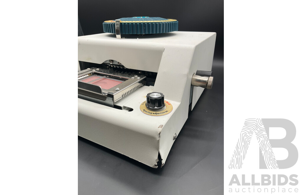 Manual Metal Embossing Machine Used to Create Identification Tags
