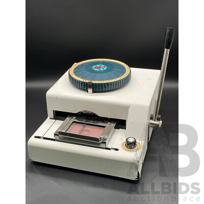 Manual Metal Embossing Machine Used to Create Identification Tags
