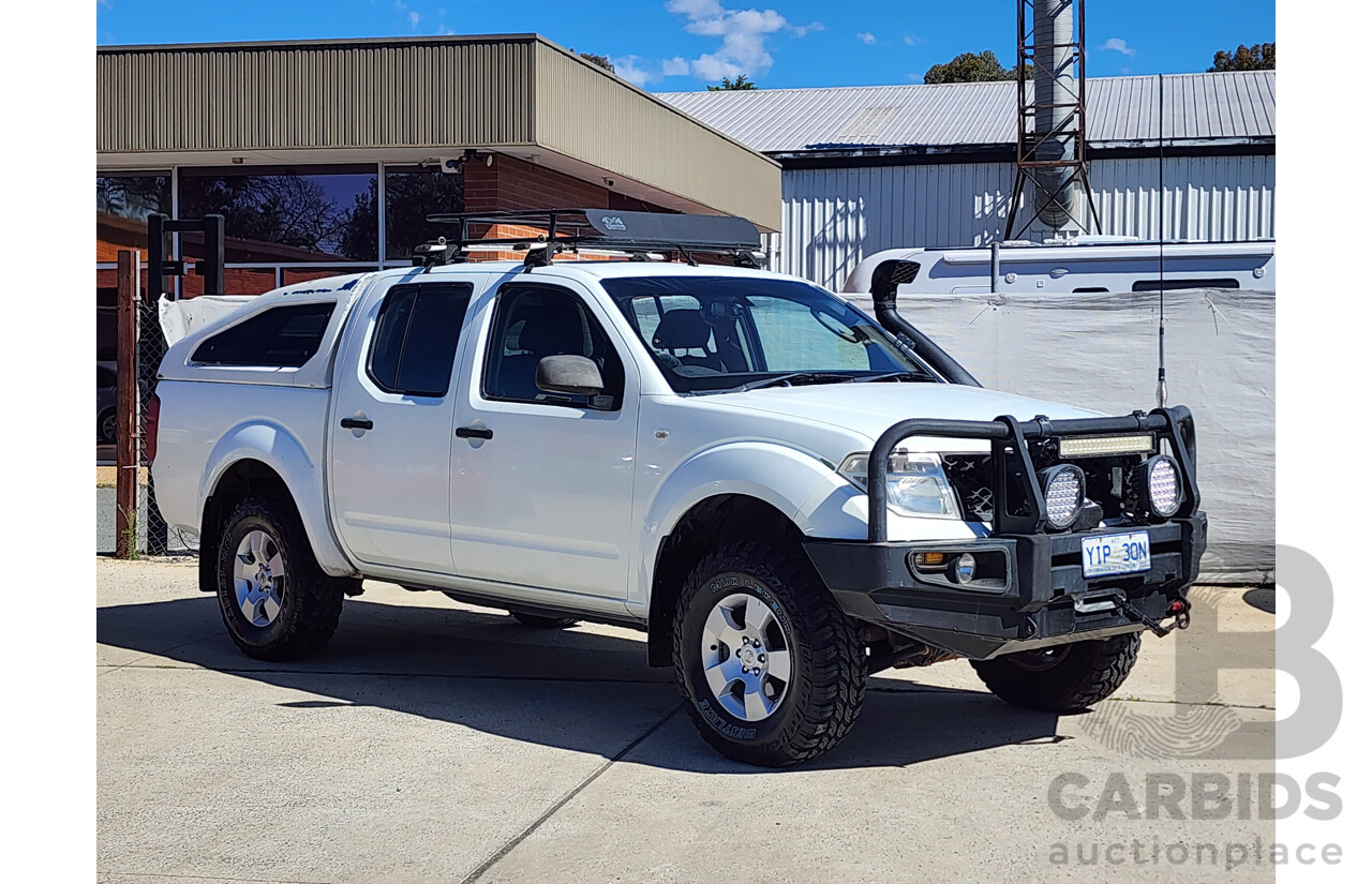 2/2009 Nissan Navara RX (4x4) D40 Dual Cab P/Up White 2.5L